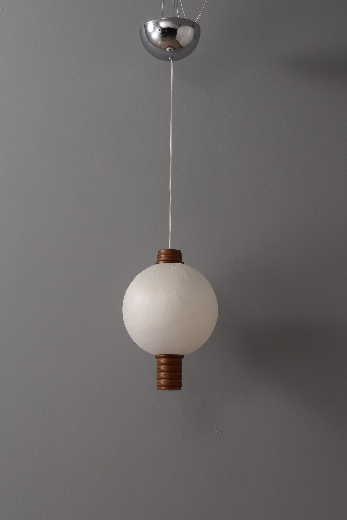 1-globe vertical natural mulberry silk pendant with dark wood details, real product photograph