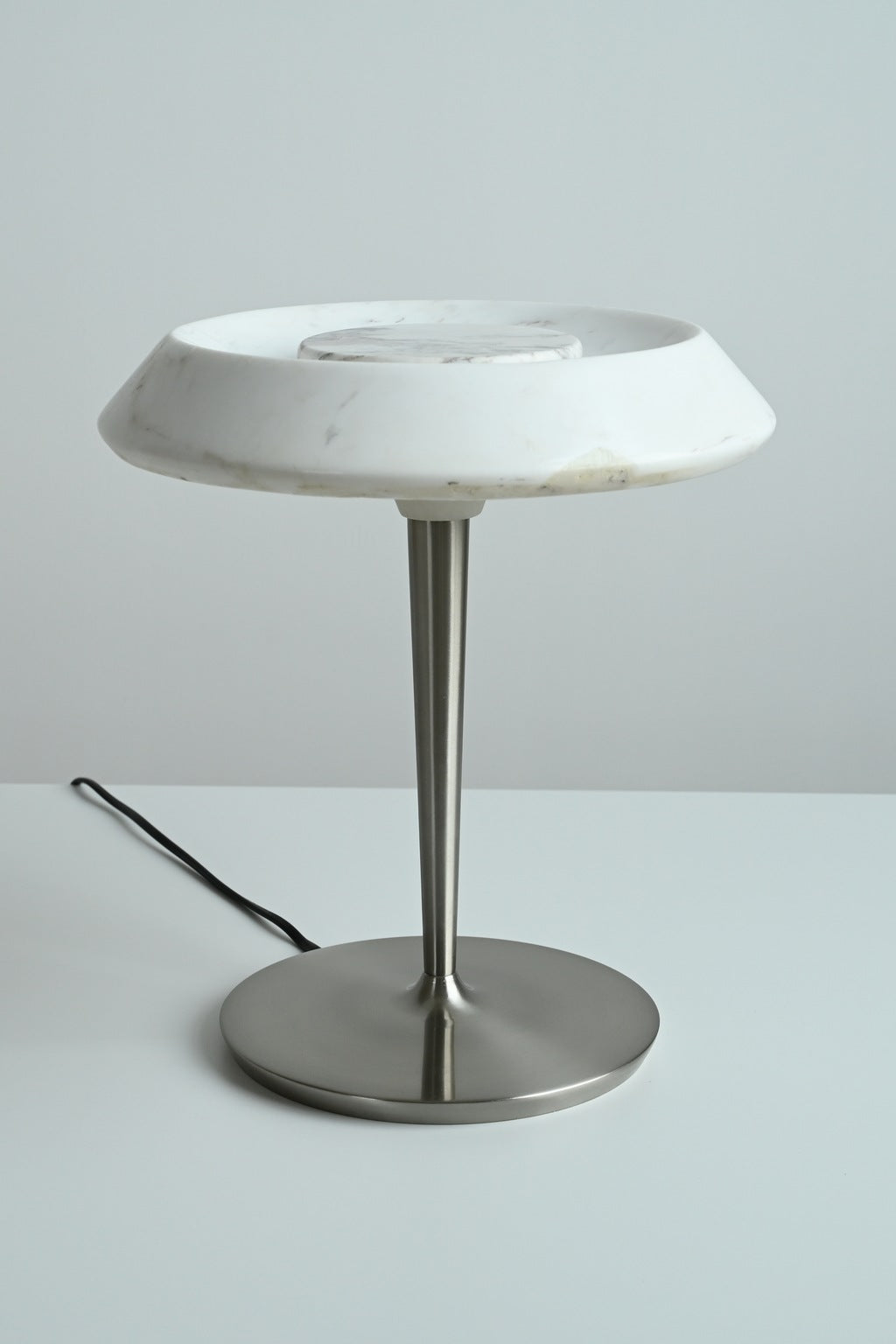 Solvenne Carrara white marble table lamp unlit in a front studio view