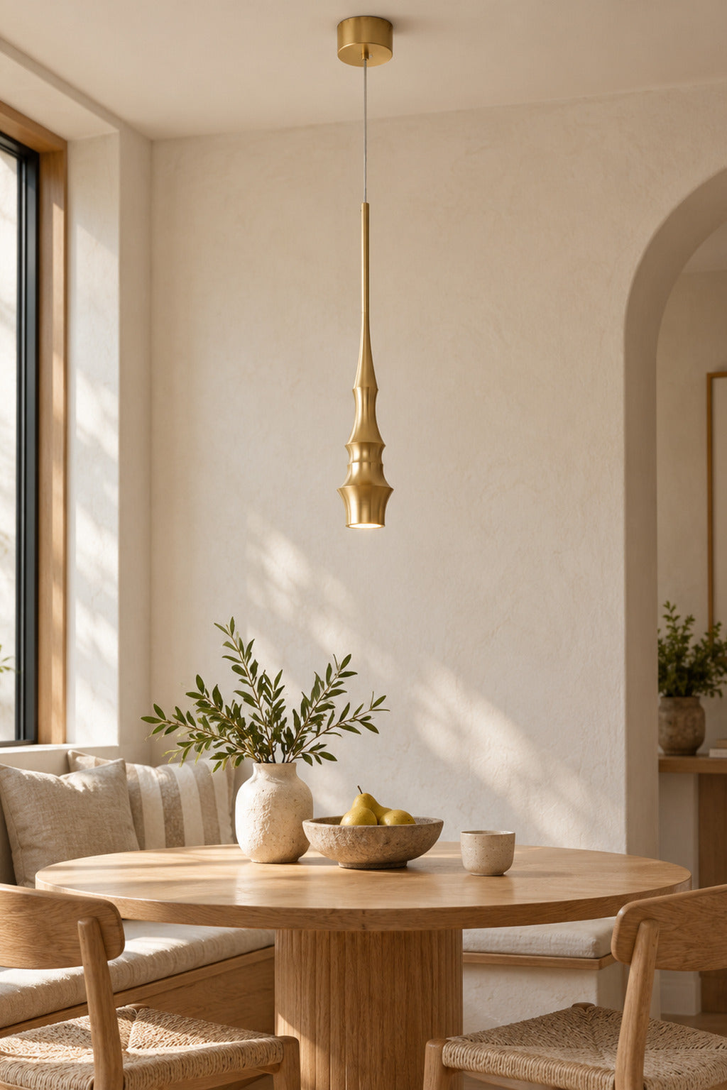 Torvelle Brushed Gold Sculptural Pendant Light in a styled interior scene 1 · CDE expanded 2026-09-21