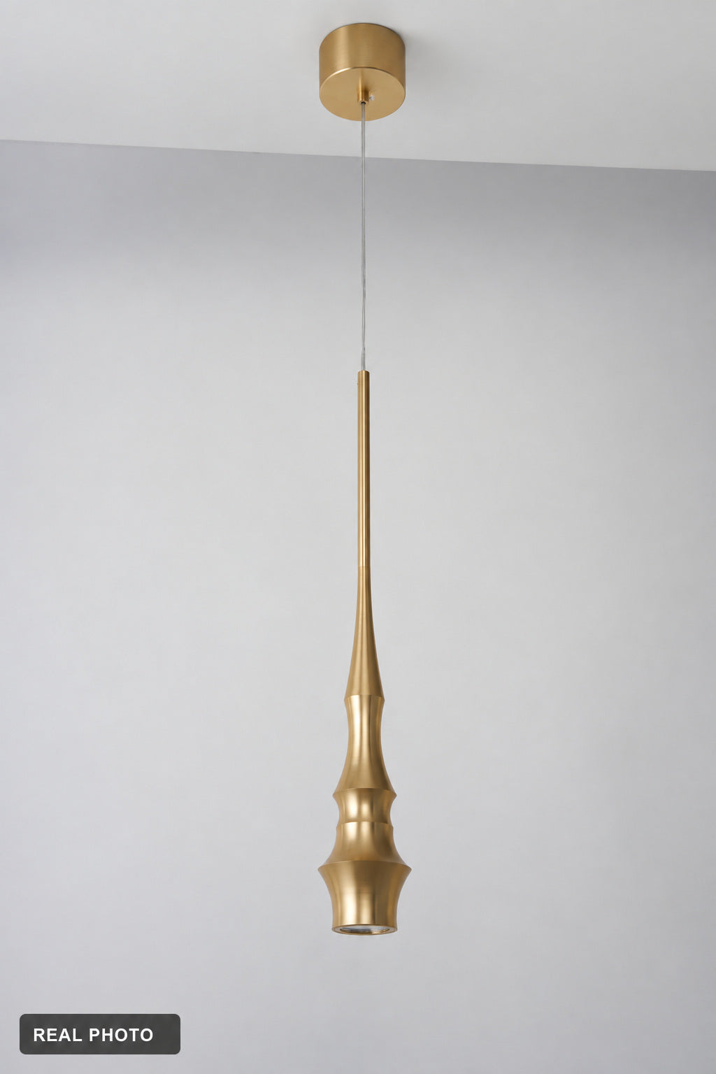 Torvelle Brushed Gold Sculptural Pendant Light real product photo 4 — REAL PHOTO · clean ceiling revision 2026-09-24