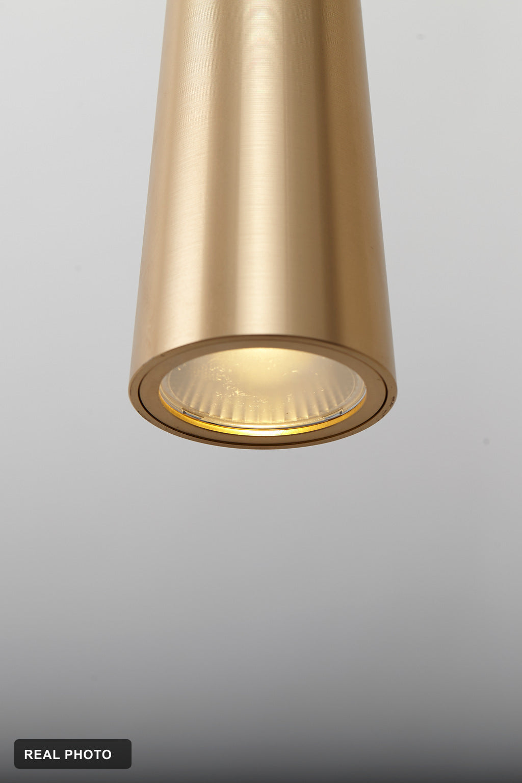 Torvelle Brushed Gold Sculptural Pendant Light real product photo 7 — REAL PHOTO · CDE corrected 2026-09-24