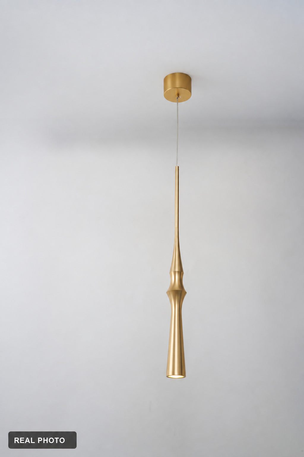 Torvelle Brushed Gold Sculptural Pendant Light real product photo 11 — REAL PHOTO · clean ceiling revision 2026-09-24