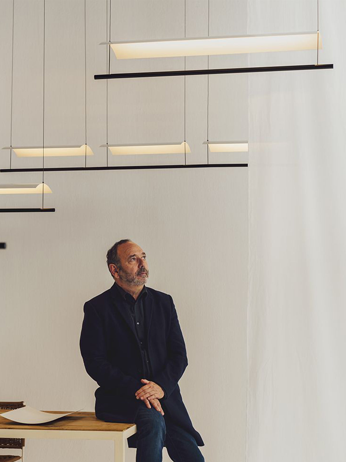 Veilane lighting collection display with a person for scale; fixtures sold separately