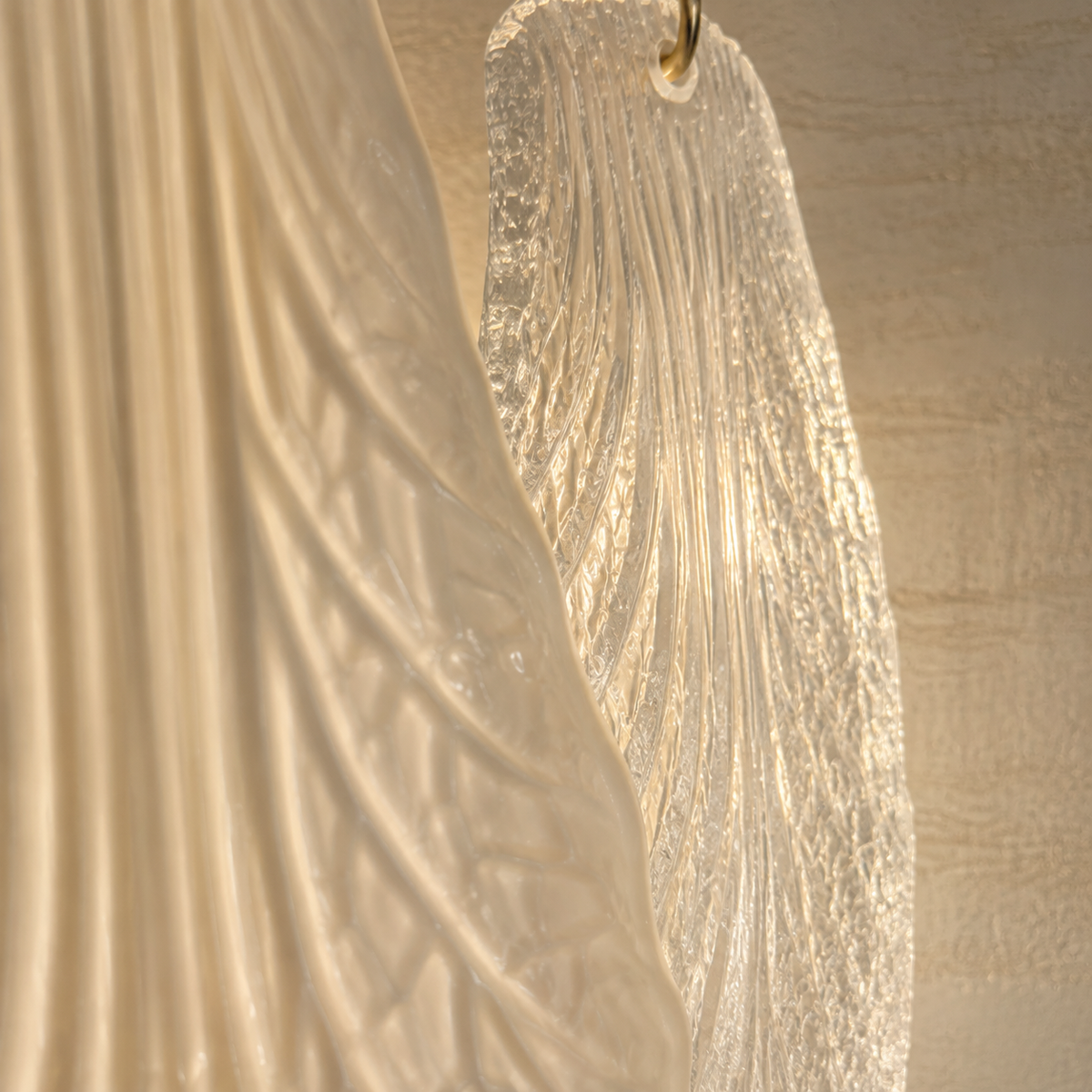 Ceramic and Glass Petal Wall Sconce: close view of ivory ceramic and textured glass surfaces