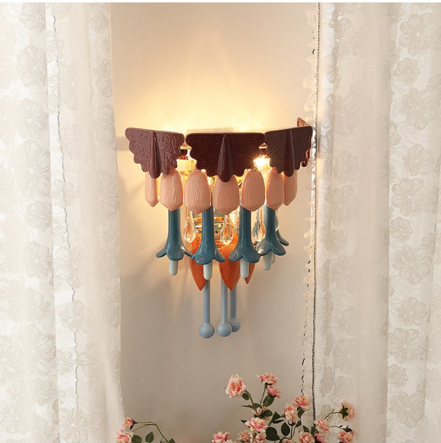 Colorful wall sconce glowing softly on a neutral wall