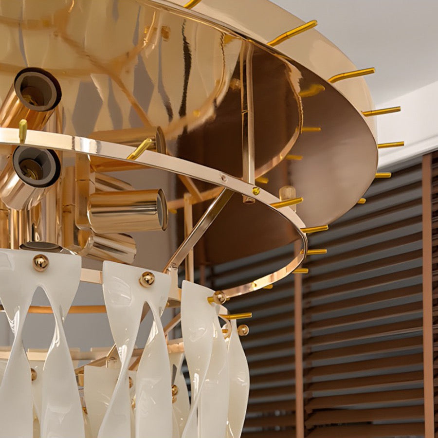 Gold-tone circular frame and ceramic ribbon attachment detail