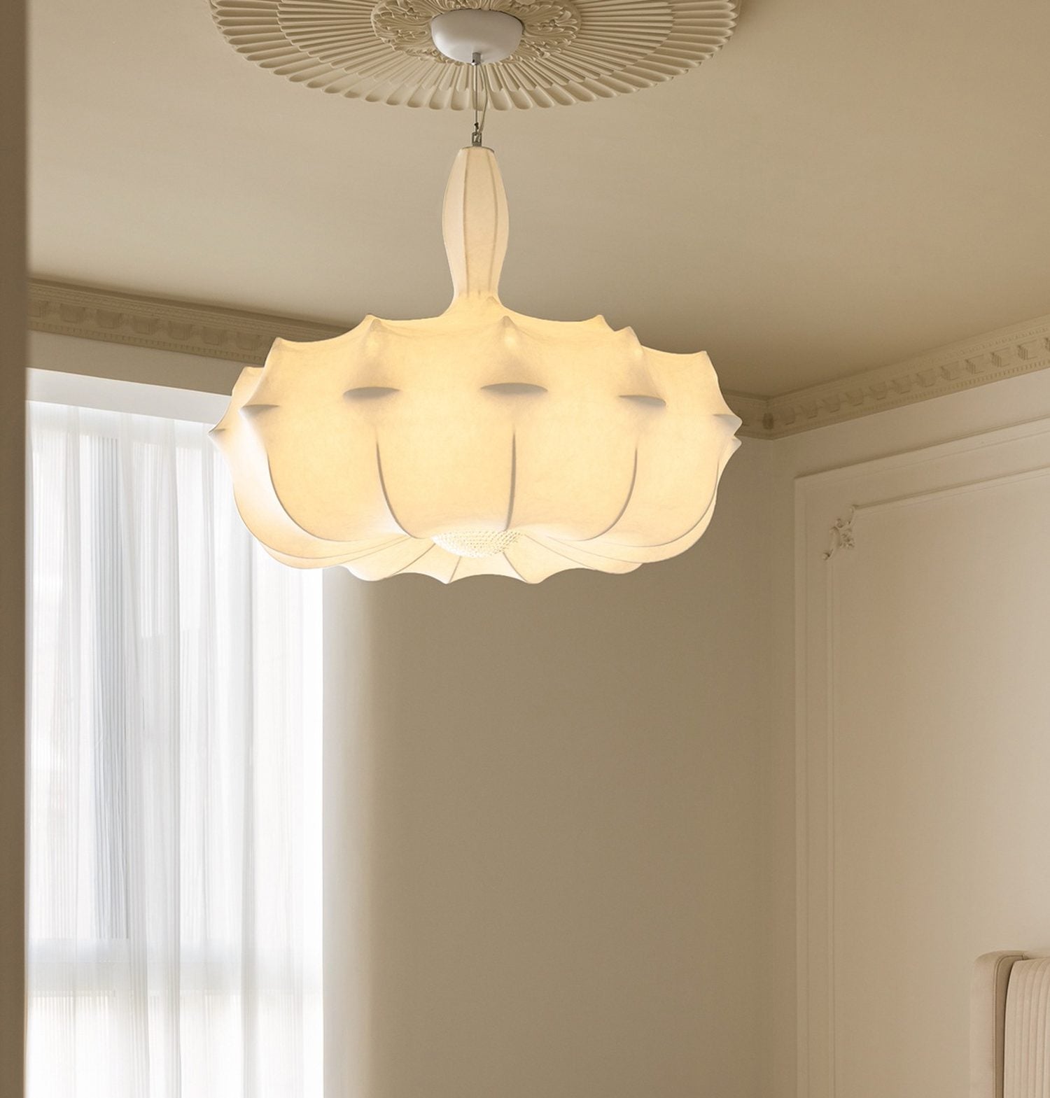 Soft pendant light in a bedroom setting