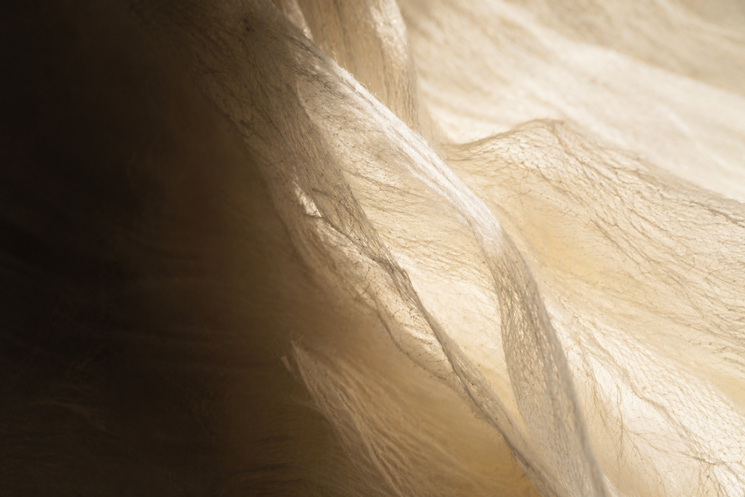Handmade mulberry silk fibers with soft warm light