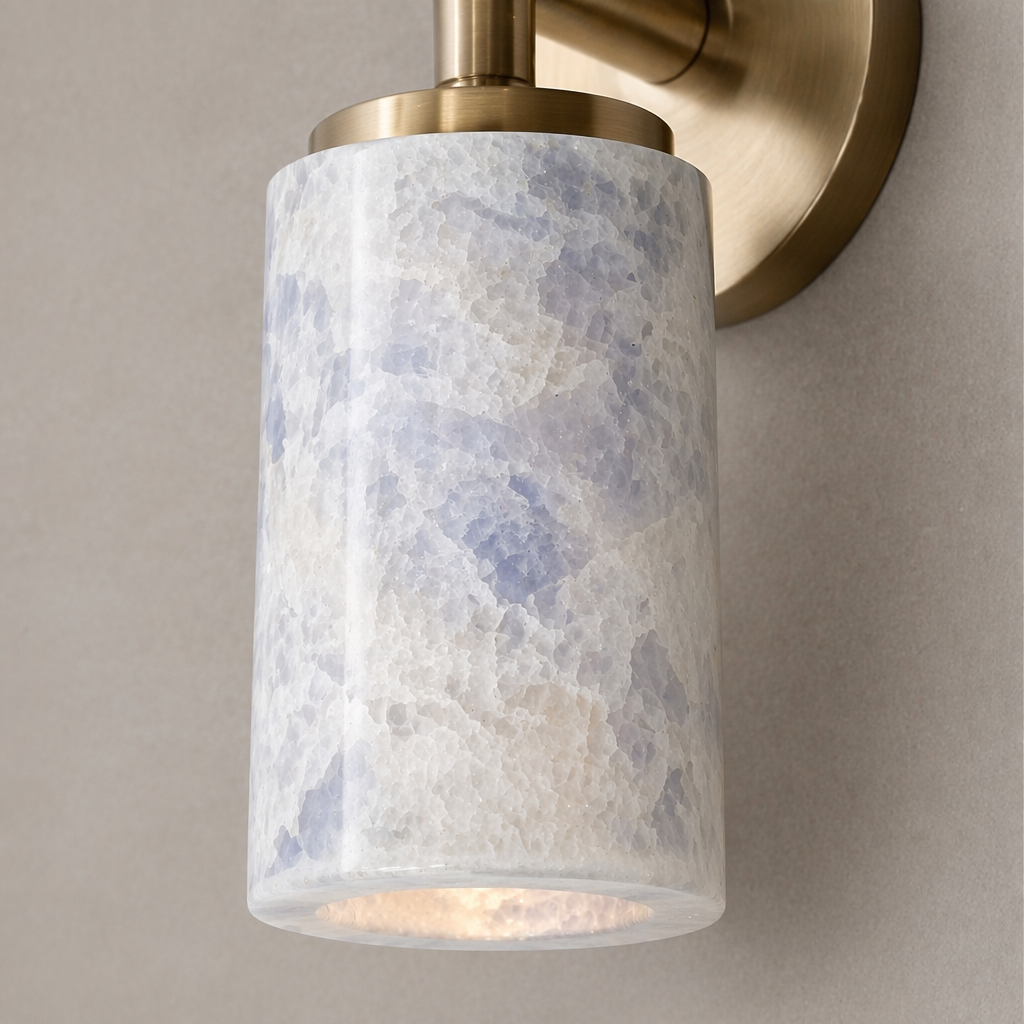 Sapphire crystal wall light detail with brushed brass hardware