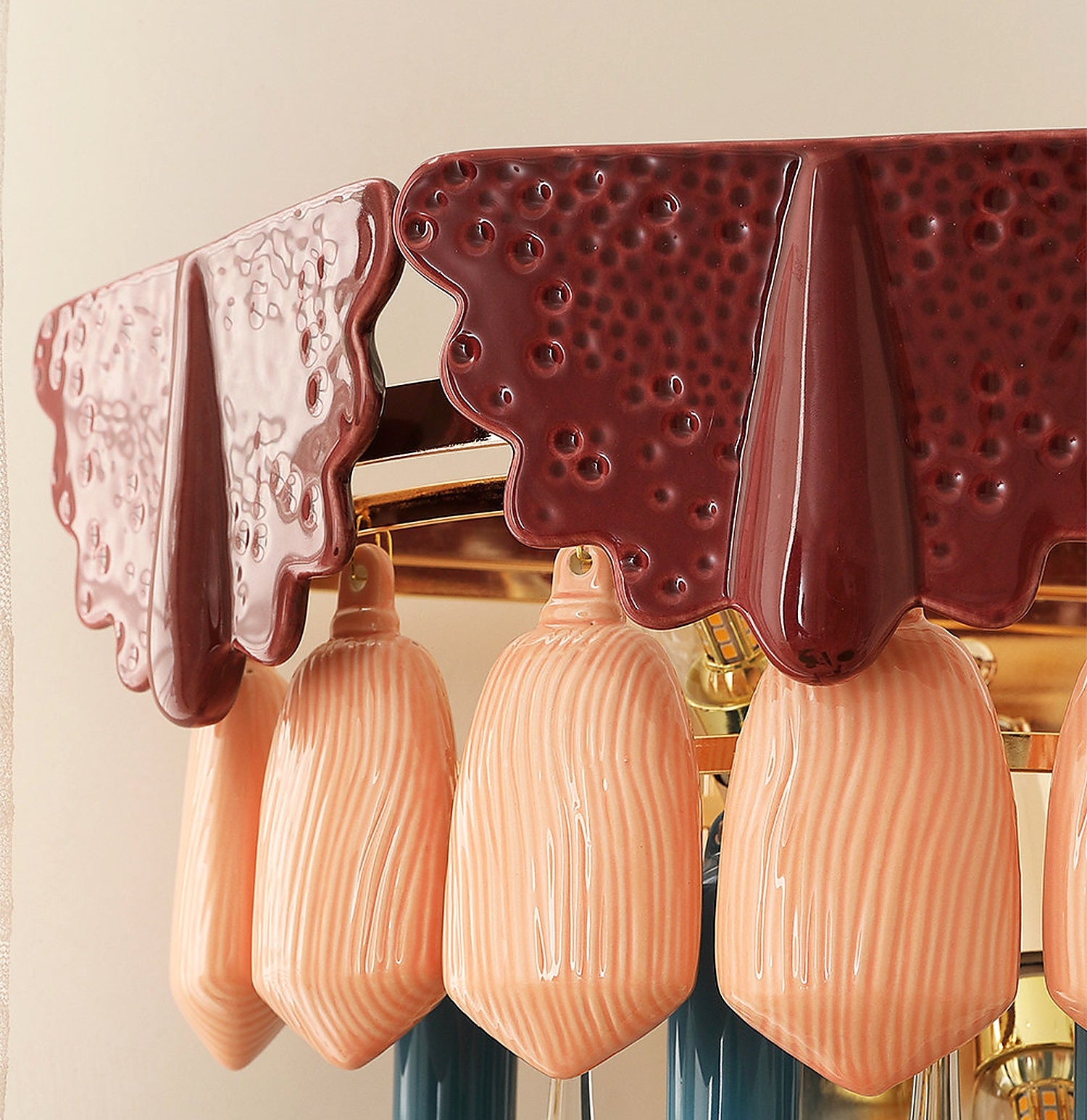 Glossy ceramic petal detail on colorful wall sconce