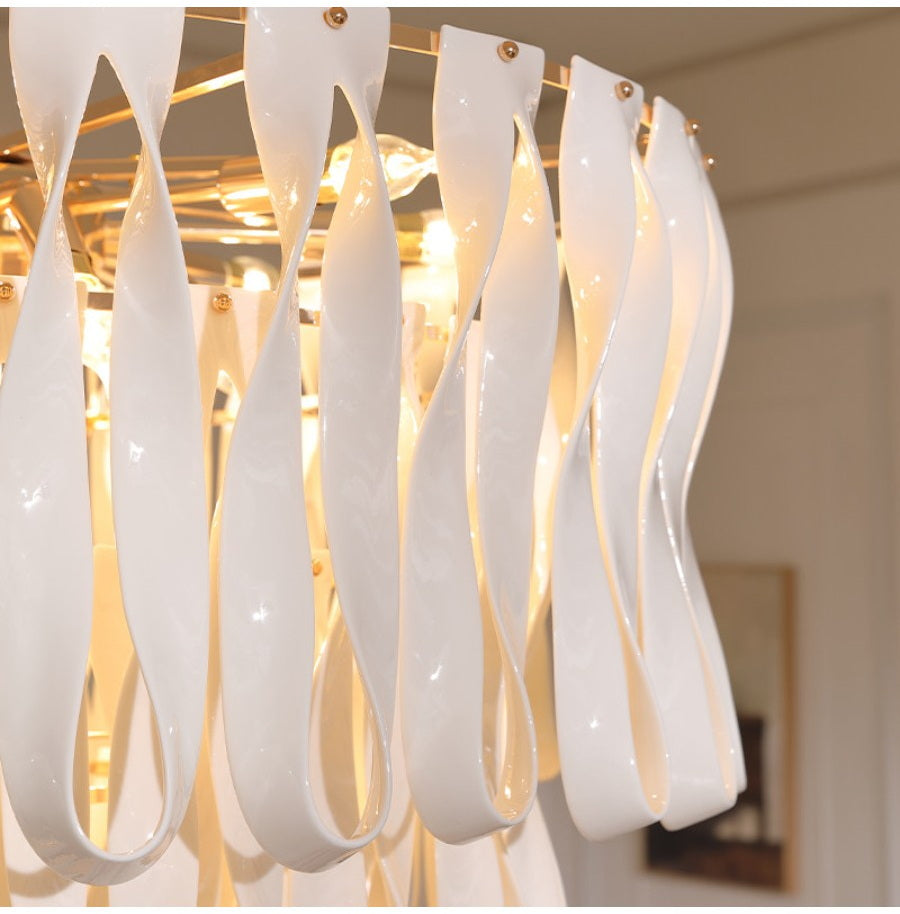 Close view of glossy white ceramic ribbon pendants