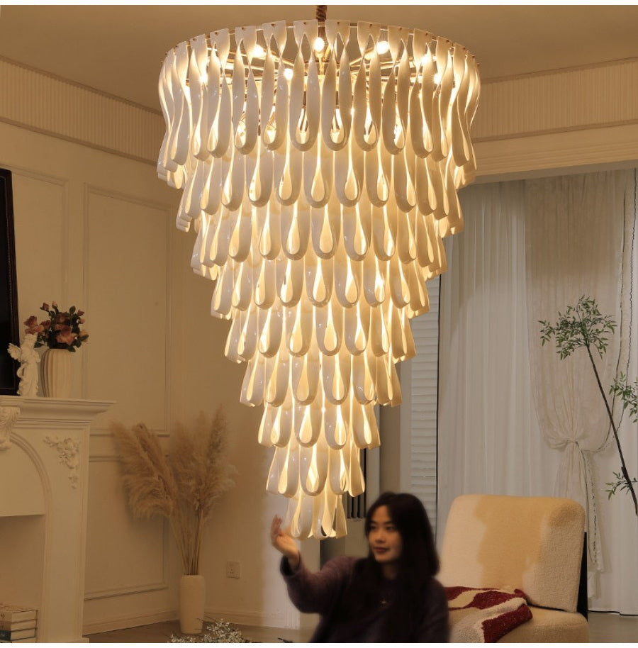 Grand ceramic ribbon chandelier shown with room scale